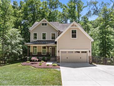 Beautiful two-story home with a welcoming front porch, attached two-car garage, and well-maintained landscaping at 3425 Donnigale Ave, Durham, NC 27705