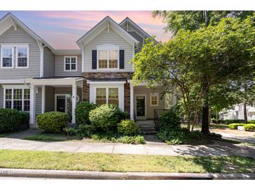 Charming two-story home with stone accents and lush landscaping at 4002 Cherry Blossom Cir, Durham, NC 27713