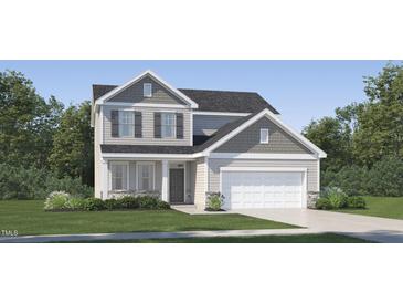 Inviting two-story home featuring a two-car garage, shuttered windows, and stone accents at 548 Morning Light Dr, Angier, NC 27501