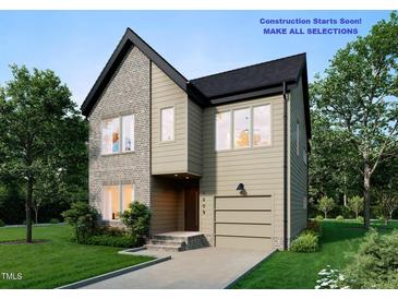New construction two-story home with brick and vinyl siding plus an attached garage in a landscaped front yard at 1809 Bennett St, Raleigh, NC 27604