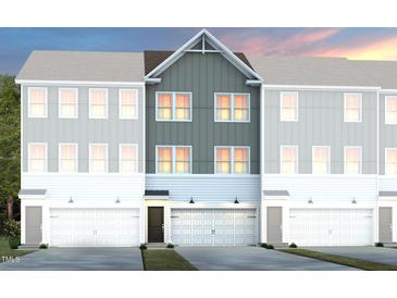 Charming townhome with attached garage and modern architectural details at 2775 Cassius Dr, Apex, NC 27502