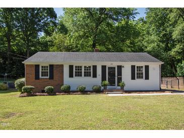 Charming single-story home featuring a combination of brick and white siding and a well-maintained front lawn at 430 Fenton St, Raleigh, NC 27604