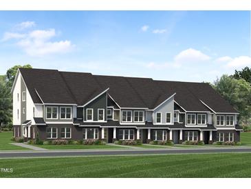 Beautiful new townhomes boast unique curb appeal with craftsman-style architecture and manicured landscaping at 805 Fireship Rd, Fuquay Varina, NC 27526