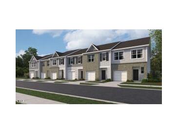 Beautiful townhome exteriors feature neutral colors, attached garages, and coordinated architectural details at 117 N Chubb Rdg, Wilson's Mills, NC 27520
