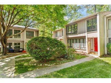 Charming townhome with a well-maintained lawn, mature trees, and updated siding at 1782 Quail Ridge Rd, Raleigh, NC 27609