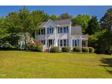 Charming two-story home with landscaped yard and beautiful curb appeal on a sunny day at 2 Great Oak Ct, Durham, NC 27713