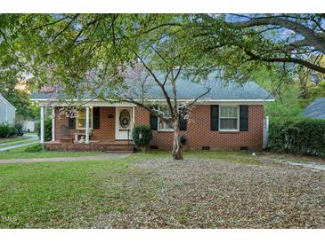 Charming brick home with mature trees and well-maintained front yard at 418 S 2Nd St, Smithfield, NC 27577
