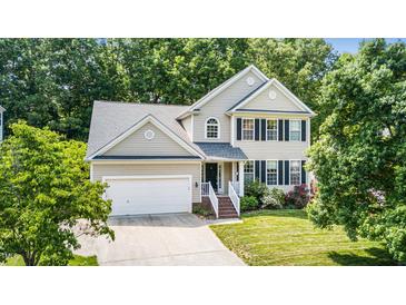 Charming two-story home features a two-car garage, landscaped yard, and welcoming front porch at 437 New Parkside Dr, Chapel Hill, NC 27516