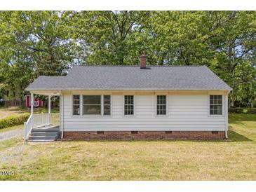 Charming single-story home featuring a classic brick foundation and neutral exterior with a well-maintained lawn at 1013 Graham St, Burlington, NC 27217
