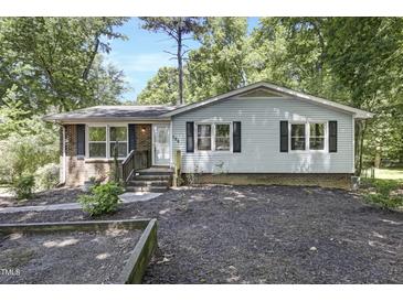Charming one-story home featuring a brick and siding exterior with a welcoming front yard at 106 Argyle Ct, Garner, NC 27529