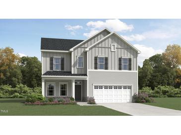 Charming two-story home showcasing light gray siding, black shutters, and an attached two-car garage at 1556 Bright Coral Trl, Wendell, NC 27591