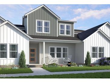 Charming two-story home featuring board and batten siding and a welcoming covered front porch at 2915 Alyssa Ct, Raleigh, NC 27604