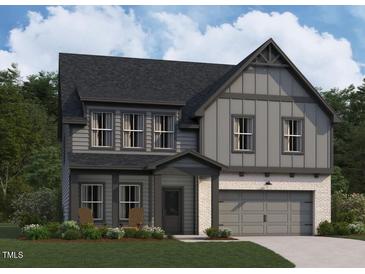 Charming two-story home with gray siding, stone accents, and a welcoming front porch at 4317 Emeline Way # 12, Fuquay Varina, NC 27526