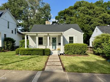 Charming one-story home with a well-manicured lawn, inviting front porch, and vibrant landscaping at 1510 Hanover St, Raleigh, NC 27608