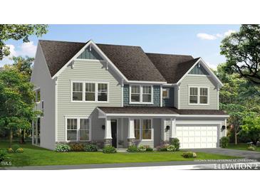 Charming two-story home featuring a covered porch, gray siding, and an attached two-car garage at 264 Alden Way, Angier, NC 27501