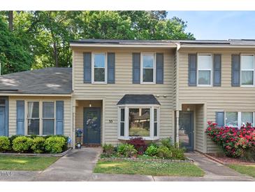 Charming townhome with neutral siding, bay window, and a well-manicured front yard at 35 Stonewall Way, Durham, NC 27704