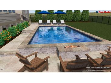 A stunning pool with lounge chairs, umbrellas, and fire pit offers a relaxing outdoor space at 25 Westbourne Ln, Youngsville, NC 27596