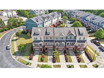 Beautiful townhomes feature landscaped yards and charming exterior design, offering a delightful curb appeal at 710 Samuel Cary Dr, Cary, NC 27511