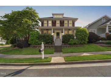 Charming two-story home with landscaped front yard and inviting porch at 112 Homegate Cir, Apex, NC 27502