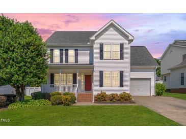 Charming two-story home with a well-manicured lawn, inviting porch, and a classic design at 3315 Swinford Ct, Raleigh, NC 27604