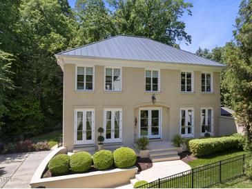 Elegant two-story home with manicured front yard and neutral stucco exterior at 3617 Carlow Ct, Raleigh, NC 27612