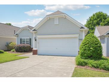 Charming one-story home with a two-car garage, well-maintained landscaping and lovely curb appeal at 519 Garendon Dr, Cary, NC 27519