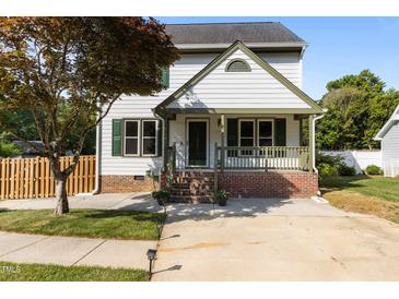 Charming two-story home with a welcoming front porch and well-maintained landscaping at 1114 Balmoral Dr, Cary, NC 27511