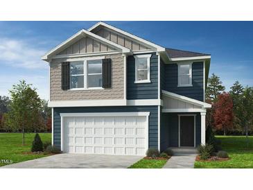 Charming two-story home featuring a two-car garage and a beautifully designed facade with complementary tones at 2628 Pivot Ridge Dr, Raleigh, NC 27616