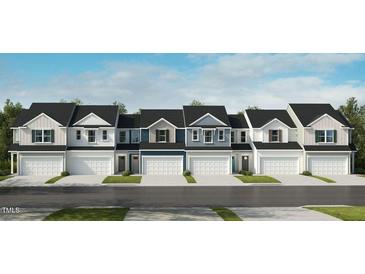 A row of new townhomes featuring varying neutral colors, modern garages, and well-maintained lawns at 108 Malbec Dr, Chapel Hill, NC 27516