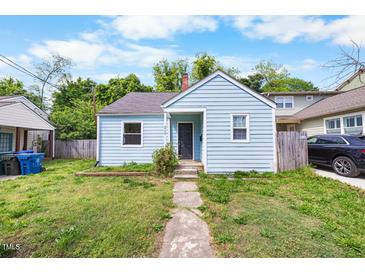 Charming blue one-story home with a neatly landscaped front yard and inviting entrance at 212 Northwood Cir, Durham, NC 27701