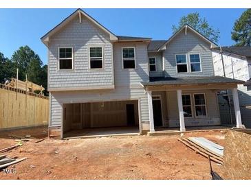 New construction home with gray siding, double windows, and an attached two-car garage ready to be completed at 436 Golden Dragonfly St, Wake Forest, NC 27587
