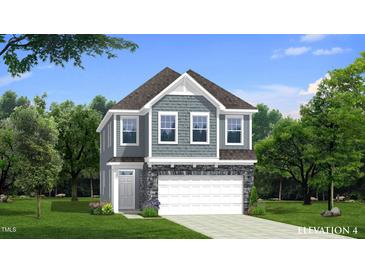Charming two-story home featuring gray siding, stone accents, and a welcoming front entrance at 1024 Channel Drop, Zebulon, NC 27597