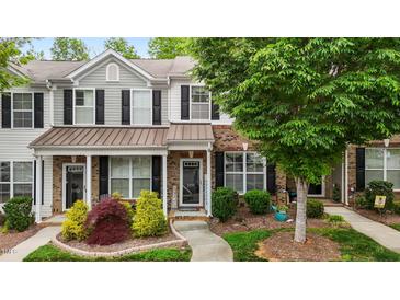 Charming townhome featuring a well-manicured front yard and a welcoming entrance at 1096 Kelso Ln # 18, Burlington, NC 27215