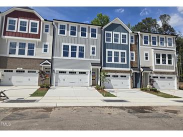 Charming townhomes with individual garages, lovely colors, and inviting curb appeal at 2207 Lambert Rd # 69, Cary, NC 27519