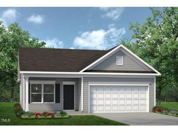 Charming single-story home with gray siding, a well-manicured lawn, and an attached two-car garage at 322 Deodora Ln, Cameron, NC 28326