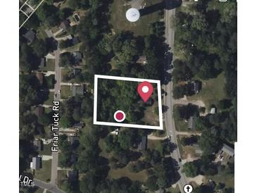 Aerial view of a property with a house nestled among trees near Friar Tuck Road at 630 Sunny Brook Rd, Raleigh, NC 27610