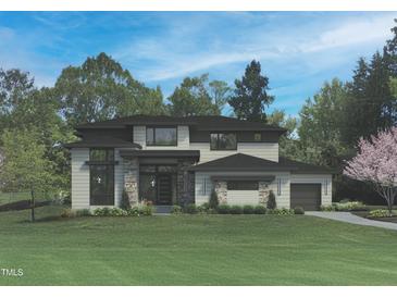 Stunning two-story home with a modern design and a well-manicured lawn, perfect for families at 7652 Falls Creek Ln, Raleigh, NC 27614