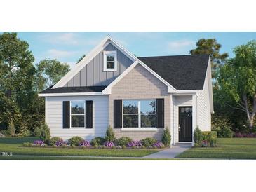 Charming single-Gathering home featuring a mix of brick, siding, and a well-manicured front lawn at 1304 White Verona Way, Knightdale, NC 27545