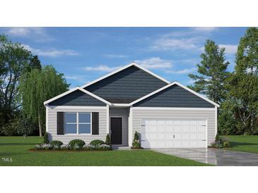 Charming single-Gathering home with a two-car garage, manicured lawn, and beautiful landscaping at 3608 Sorda Ct, Raleigh, NC 27610