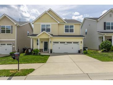 Charming two-story home with a well-manicured lawn and a two-car garage, perfect for suburban living at 4024 Dunkirk Dr, Burlington, NC 27215