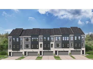 Newly constructed townhomes with gray siding, stylish black trim, and individual one car garages at 10514 Pleasant Branch Dr # 35, Raleigh, NC 27614