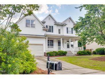 Charming two-story home featuring a welcoming front porch and well-manicured lawn at 120 Hatchet Creek Ct Ct, Morrisville, NC 27560