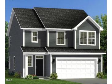 Charming two-story home featuring a two-car garage, gray siding, and white trim, creating a welcoming curb appeal at 230 Steel Spring Rd # 49, Angier, NC 27501
