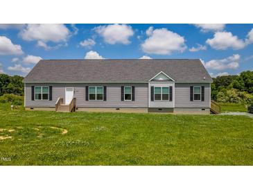 Charming one story home with gray siding, black shutters, and a well-maintained front yard at 2912 Epps Clark Rd, Siler City, NC 27344