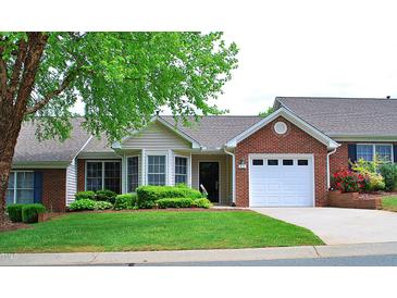 Charming single-story home featuring well-maintained landscaping and an attached one-car garage at 3027 Maple Ave # Apt K3, Burlington, NC 27215