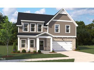 Charming two-story home with gray siding, white trim, a covered porch, and an attached two-car garage at 549 Contempo Ct # 6, Rolesville, NC 27571