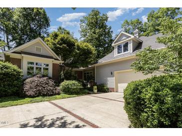 Beautiful home featuring a two-car garage and meticulously maintained landscaping at 27425 Walker, Chapel Hill, NC 27517
