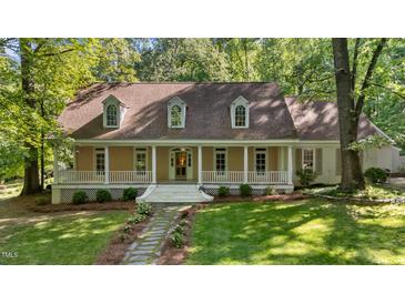 Charming home with a welcoming front porch and beautiful landscaping at 191 Nc 56, Louisburg, NC 27549