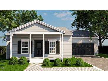 Charming single-story home with a covered front porch and black shutters at 240 Green Pines Estates Dr, Kenly, NC 27542