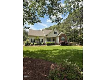 Charming home with a well-manicured lawn and beautiful landscaping at 2833 Praire View Pt, Wendell, NC 27591